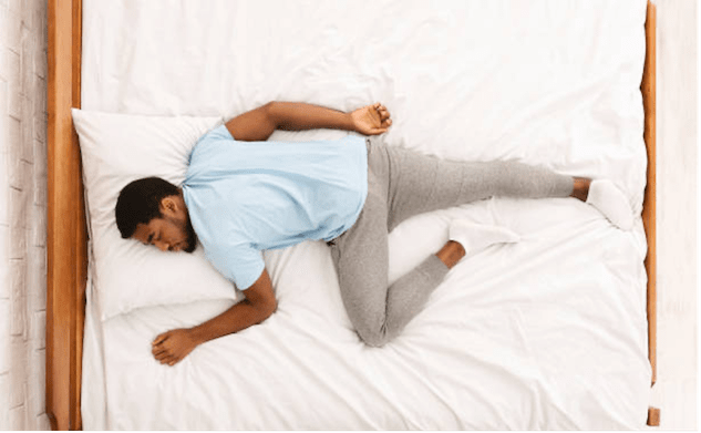Man Sleeping On Stomach